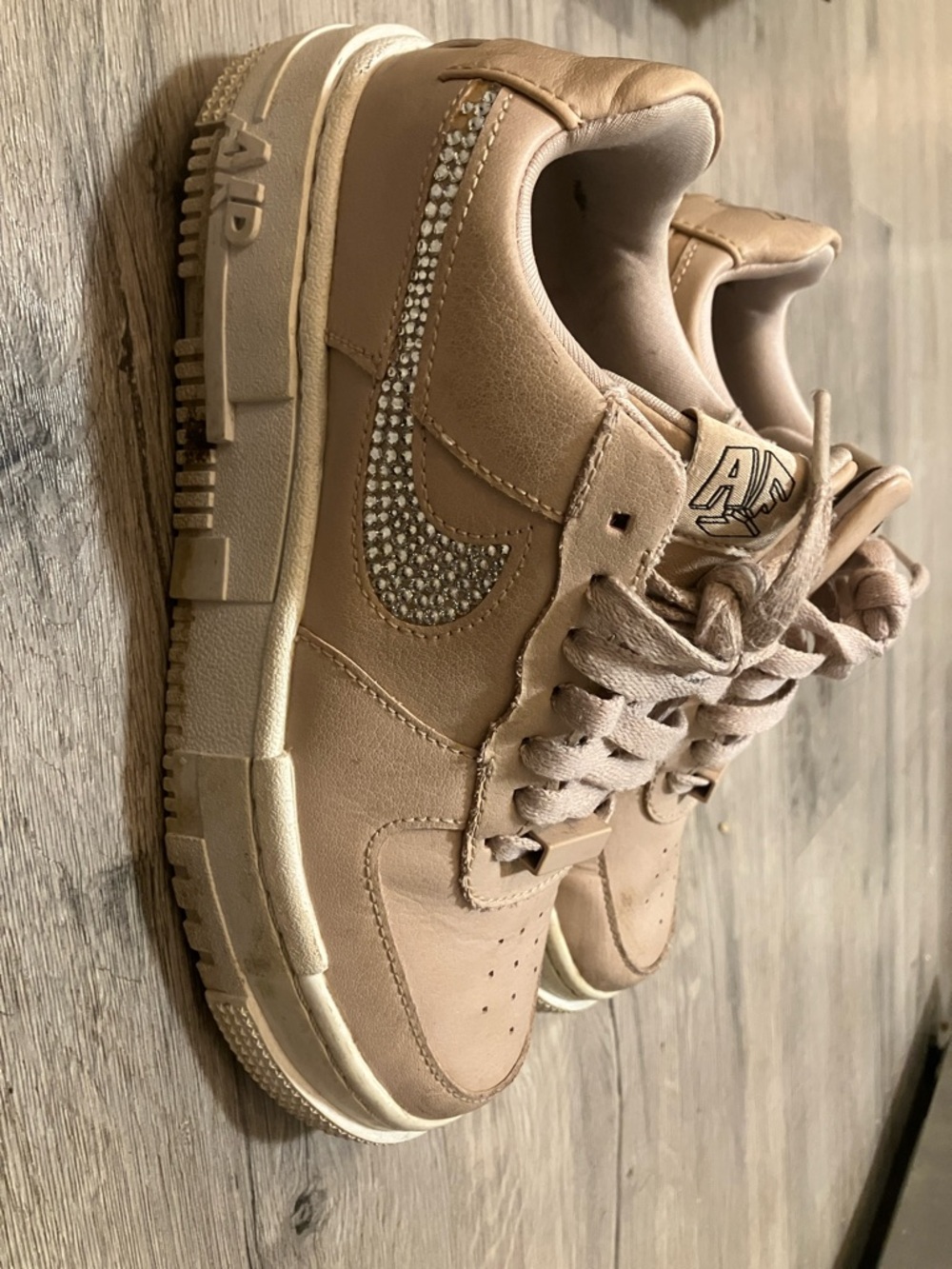Dusty pink women’s size 5.5 with bling swoosh